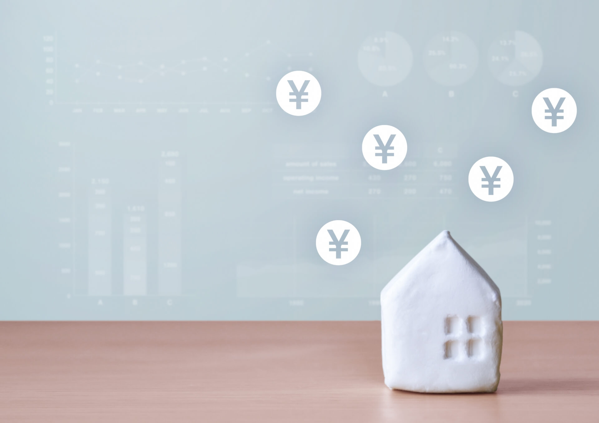 住宅と上昇する円マークのイメージ